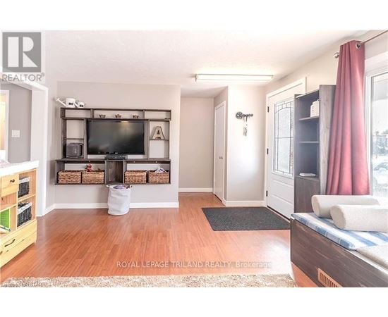 A living room with a television and a couch.
