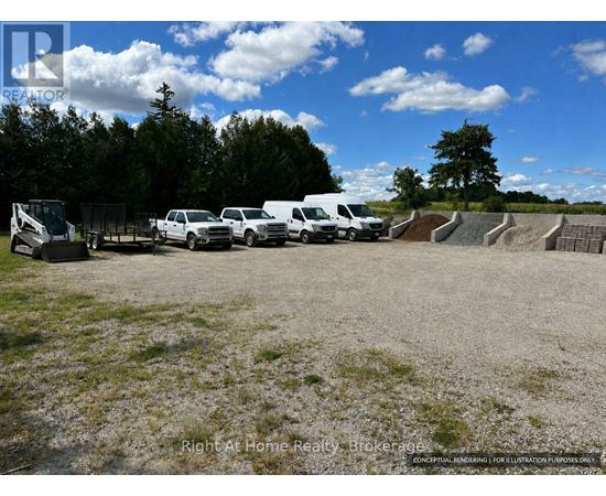 A group of white vehicles are parked in a lot.