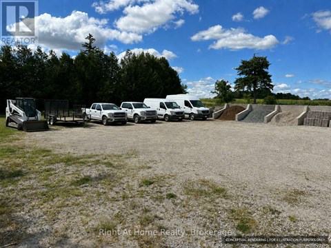 A group of white vehicles are parked in a lot.