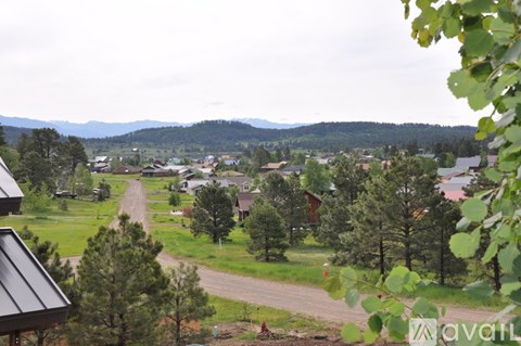A view of a residential area with houses and trees.