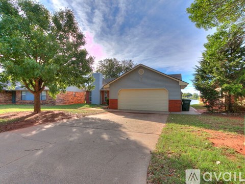 A house with a garage is available for sale.