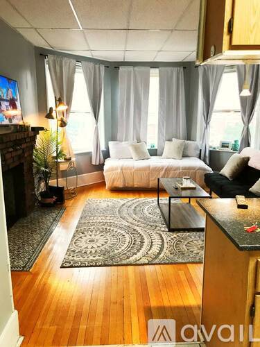 A living room with a fireplace and a couch.