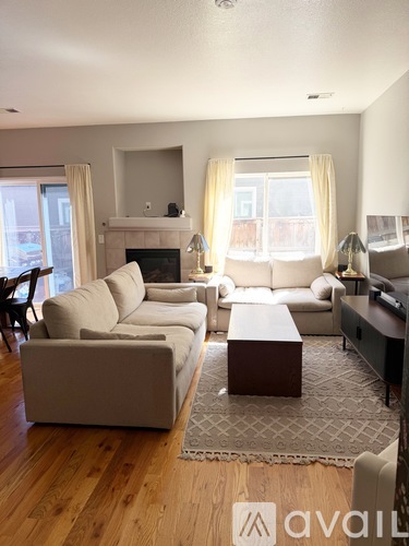 A living room with a fireplace and a couch.