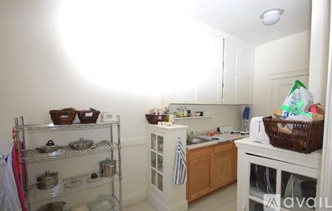 A kitchen with a white fridge, a white oven, and a white dishwasher.