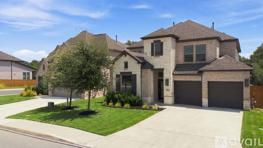 A large house with a garage is for sale.