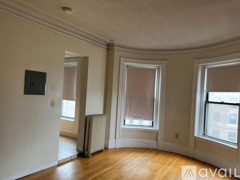 A room with a window and a radiator.