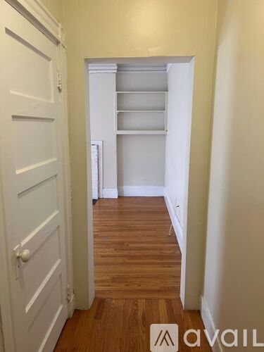 A white door is on the left and an open white doorway is on the right.