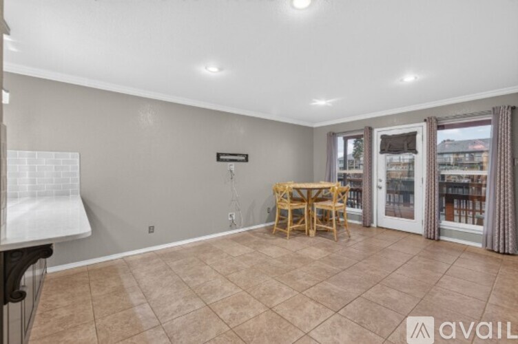 A dining area with a table and chairs is available for rent.