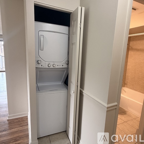 A white dishwasher is built into a wall.