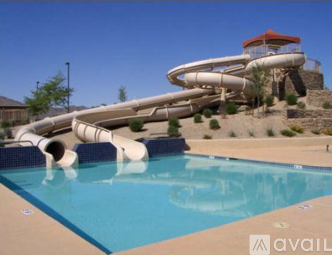 A large water slide in a pool.