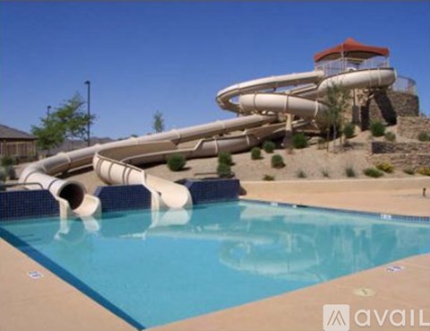 A large water slide in a pool.