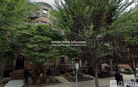 A building with the text "Atlantic Realty Consultants" and a website address is visible.