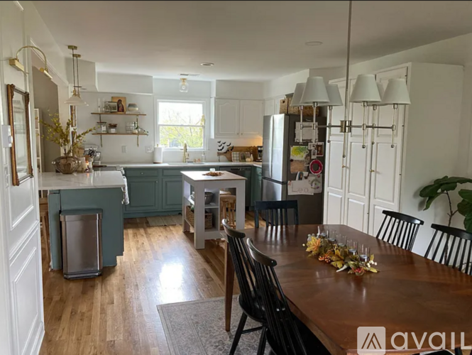A kitchen with a table set for a meal.