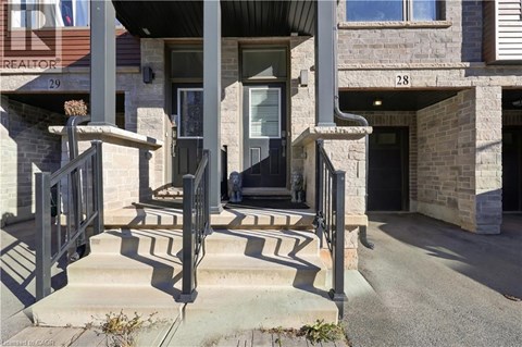 The front steps of a building with a glass door and a sign that reads "CREATOR".