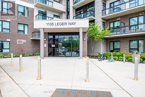 The entrance to a building with the sign 1105 Leger Way.
