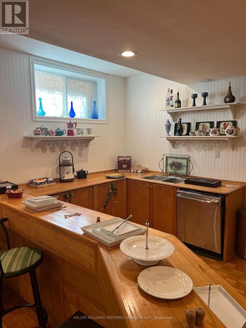 A kitchen with a wooden counter and white walls.