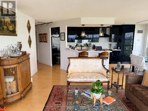 A living room with a brown chair and a rug.