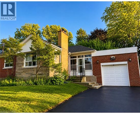 A house with a white garage door and a brick exterior.