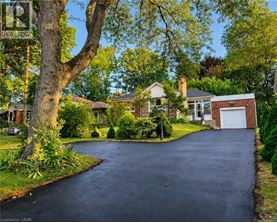 A residential area with a driveway and houses.