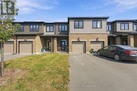 A car is parked in front of a modern two-story house.