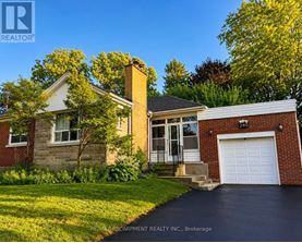 A house with a garage is for sale.