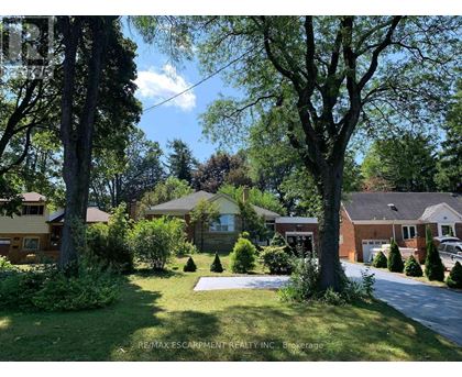 A residential area with houses and trees.