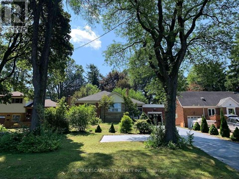 A residential area with houses and trees.