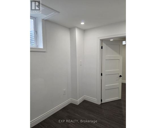 A white door is in a room with white walls.