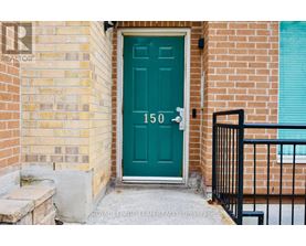 A green door with the number 150 on it.