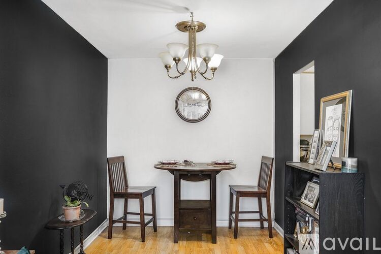A black and white room with a table and chairs.