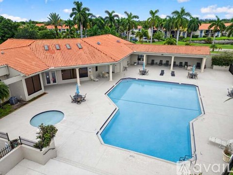 A large house with a pool in the backyard.