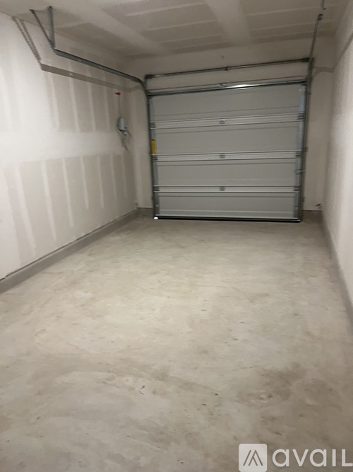 A white garage door is closed.