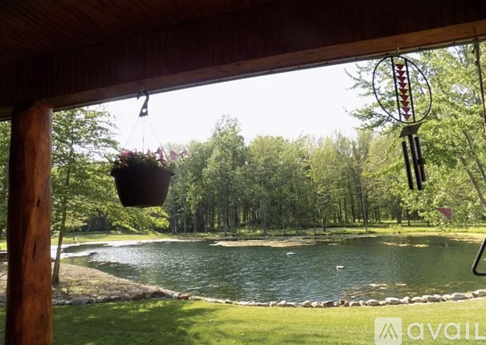A view of a lake from a wooden structure.