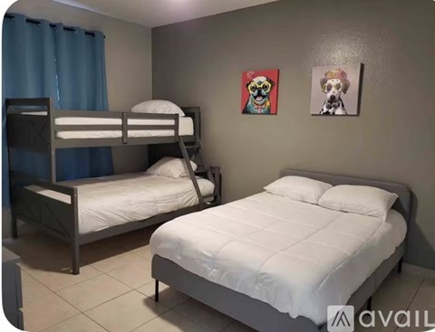 A bedroom with a bunk bed and a single bed.