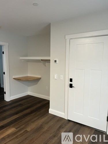 A white door is on the right side of the image.
