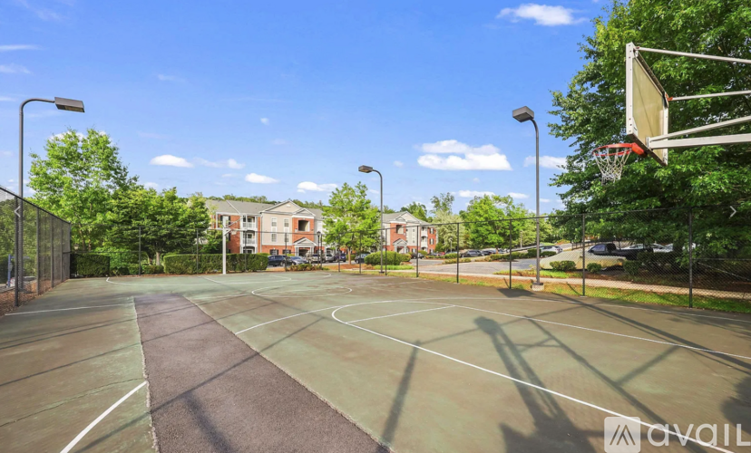 A basketball court with a basketball hoop and a basketball net.