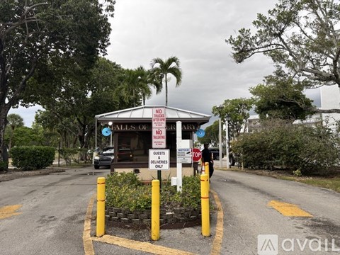 A sign in front of a building states that the area is for guests only.