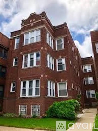 A red brick building with white trim and windows.