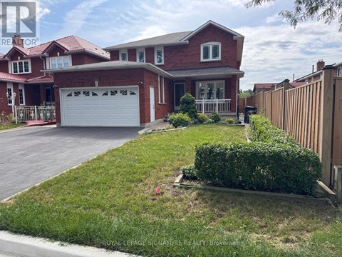 A red brick house with a white garage door is for sale.