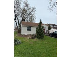 A house with a tree in front of it.