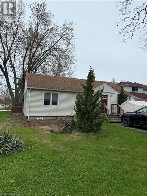 A house with a tree in front of it.