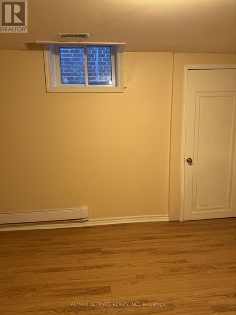 A room with a window and a door.