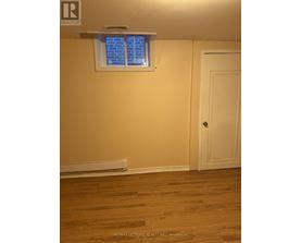 A room with a window and a door.