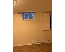 A room with a window and a door.
