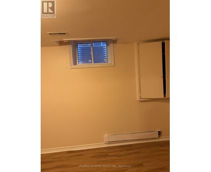 A room with a window and a door.