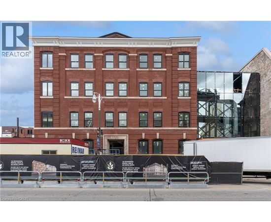 A red brick building with a sign that says REALTOR.