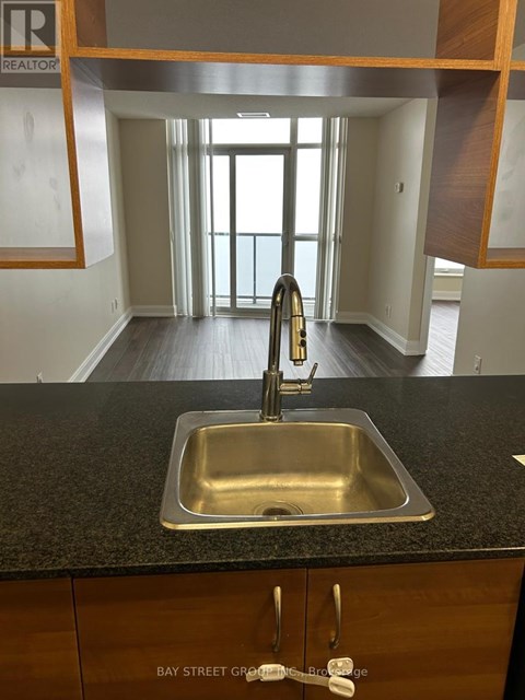 A kitchen with a sink and a window.