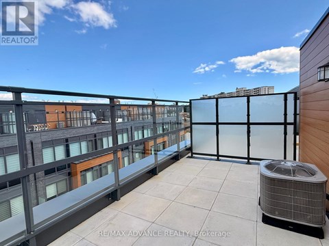 A bedroom with a large bed and a view of the city through the window.