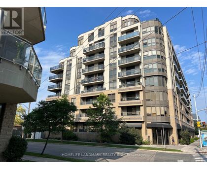 A tall apartment building with balconies and a sign that says "REALTOR" on the left side.