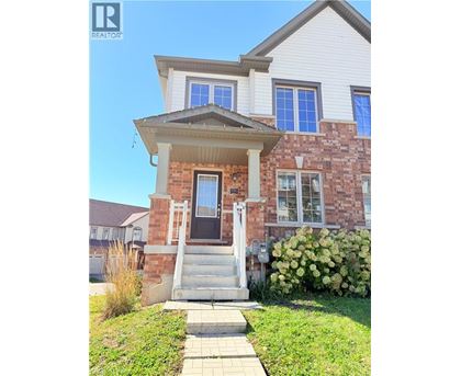 A house with a front porch and a small front yard.